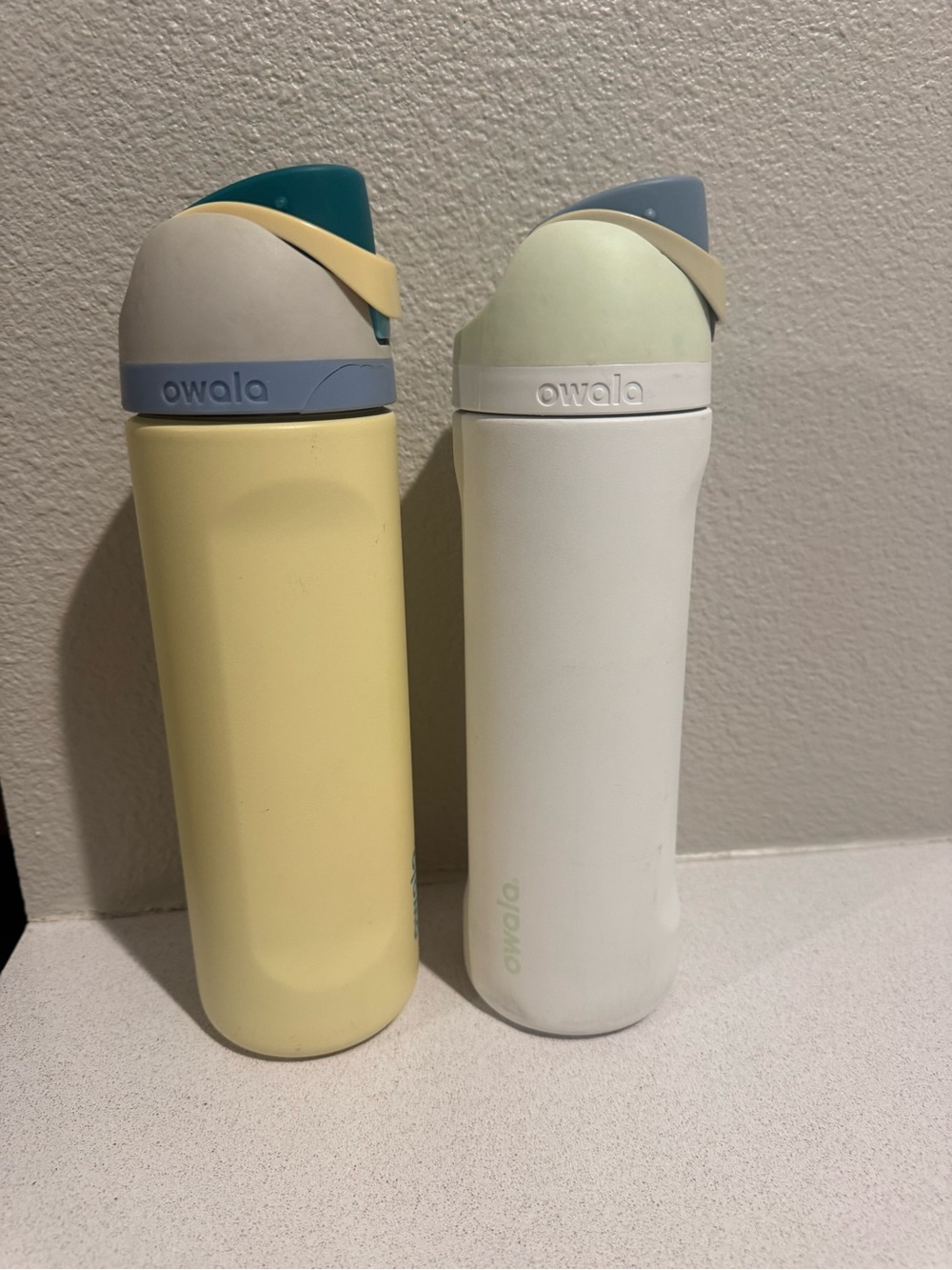 Two 24oz Owala FreeSip Stainless Steel Water Bottles - Yellow and White